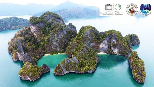 Forested tropical islands surrounded by turquoise water